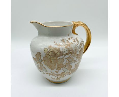 Vintage porcelain pitcher by B &amp; M China, featuring an intricate gold floral design and a glossy crackle glaze finish. Th