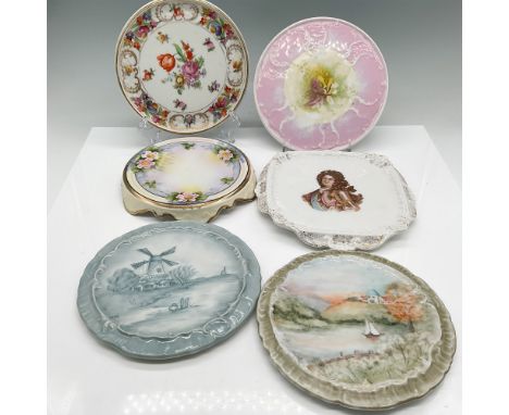 A collection of six antique and vintage porcelain trivet plates ranging from 5" - 7.5" dia., featuring a variety of intricate
