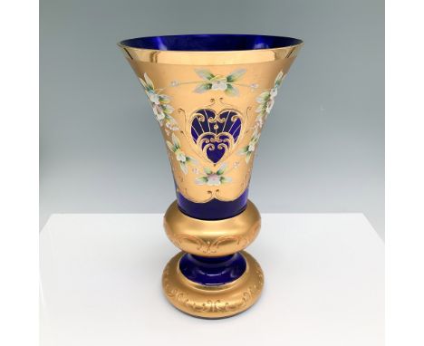 Elegant Bohemian cobalt blue glass vase with elaborate hand-painted gilt detailing and floral enamel accents. The vase featur