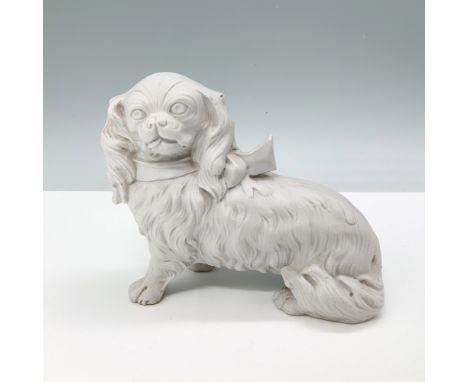 German bisque porcelain figurine of a King Charles Spaniel, marked 2102 Germany. This finely detailed piece features an intri