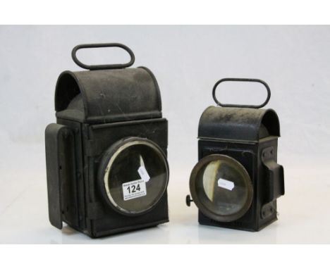 Two vintage Parrafin Lamps with black painted finish and glass lenses, the tallest example approx 24.5cm excluding carry hand