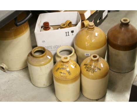 Group of vintage stone ware jars and flagons  to include James Tate &amp; Sons of Wells, Army and Navy Stores etc