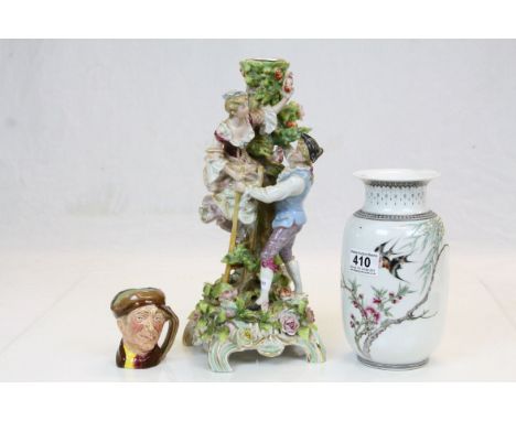 Contemporary oriental vase decorated with swallows, a miniature Royal Doulton character jug appy and a continental candlestic