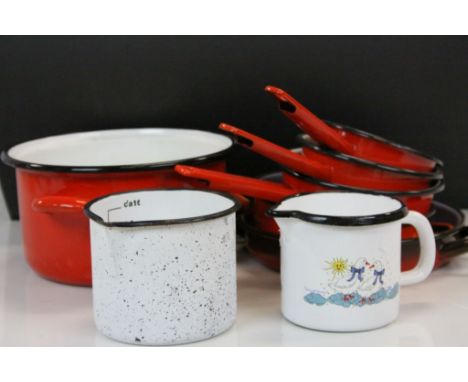 Collection of French Red Enamel Kitchenware including Three Graduating Saucepans and Three Cooking Pots plus Two other Jugs