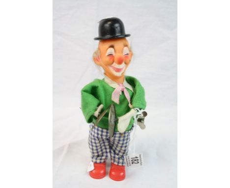 Vintage Clockwork Toy Clown playing Cymbals, marked "Hong Kong" to base, stands approx 21cm