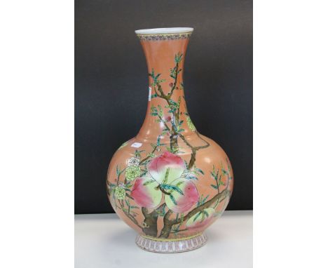 A Japanese vase with enamel floral decoration. Six character mark to the base. Measures approx 16" in height.