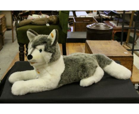 A contemporary collectable steiff Husky dog with steiff button to the ear.