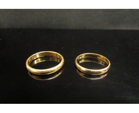 Two 22ct gold wedding bands, one miss-shapen. Sizes N/O and K (bent), 5.9g 