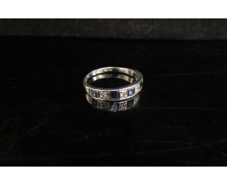 A 9ct white gold sapphire and diamond half hoop ring. Size M, 1.8g 