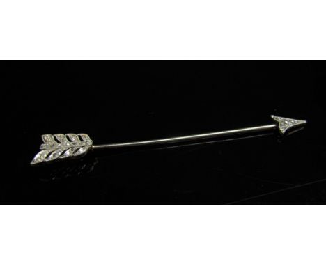 An unmarked gold and platinum stick pin as a diamond set arrow, 7.5cm long, 4.1g 