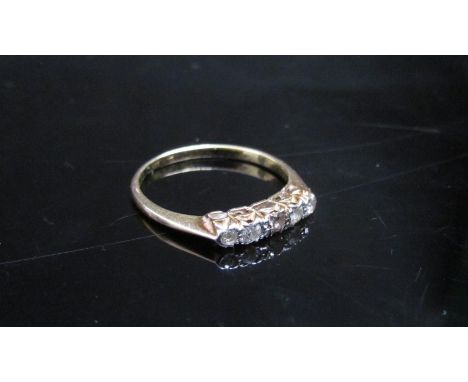 A gold five stone diamond ring marked 18ct, rubbed. Size K, 1.7g 