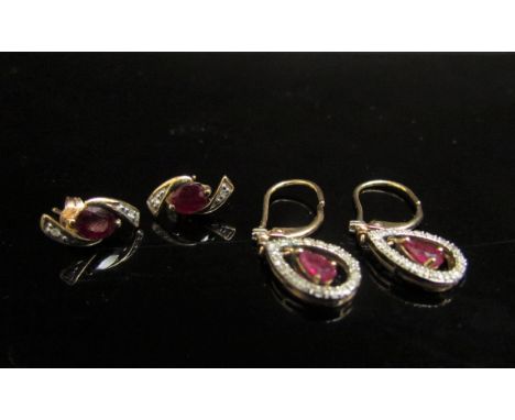 Two pairs of 9ct gold ruby and diamond earrings including a pair of drop examples, 2.8g 