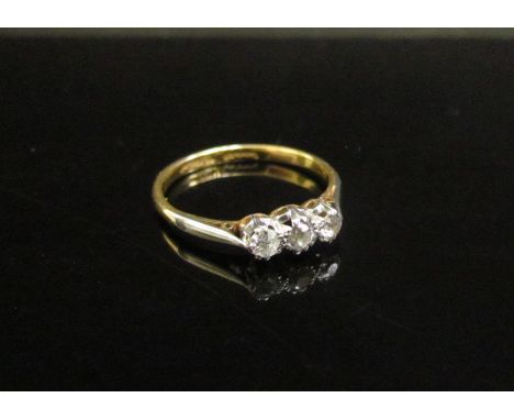 A three stone diamond ring 0.30ct total approx, stamped 18ct/plat. Size M, 2g 