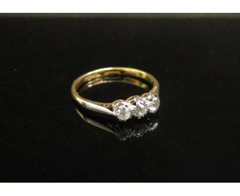 A three stone diamond ring 0.30ct total approx, stamped 18ct/plat. Size M, 2g 