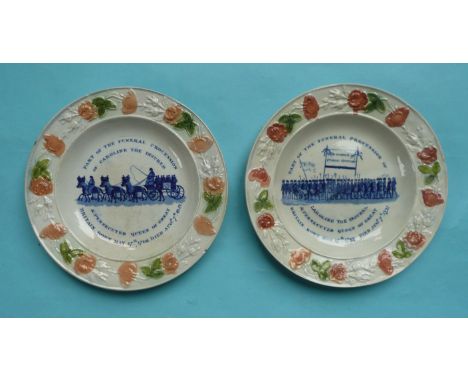 1821 Queen Caroline in Memoriam: a pair of pearlware nursery plates, the floral and foliate moulded borders decorated in yell