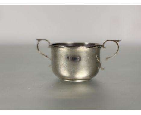 An Edwardian London silver sugar basin with S scroll handles to side with fluted rim no signs of damage or hard solder H x 5.