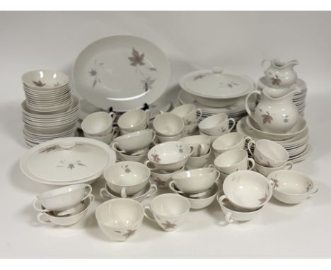 A large Royal Doulton Tumbling Leaves pattern part dinner service comprising, two tureens, three serving platters (one large,