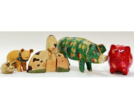 A group of collectible model pigs and piggy banks comprising studio pottery, earthenware, and polymer/resin examples (largest