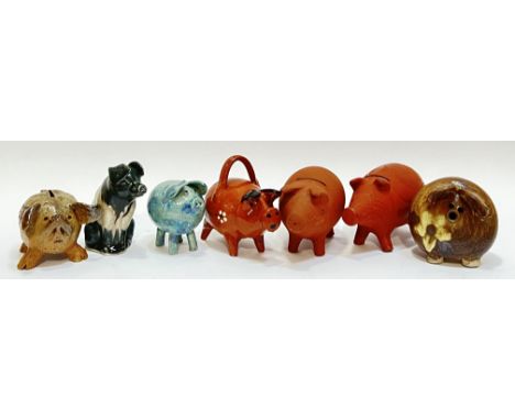A group of studio pottery and collectible model pigs and piggy banks, including earthenware and oatmeal glazed examples, Jenn