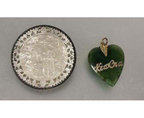 A Chinese 19thc circular mother of pearl gaming counter with pierced border and relief carved figure scene mounted as a brooc