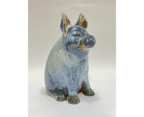 A jun glazed art pottery slip-cast model of a seated pig (h- 26.5cm)