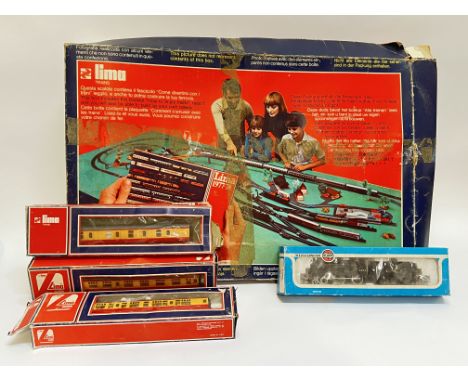 A mixed group of vintage model trains, tracks, carriages, and accessories etc....including Lima carriages and set, and an Air