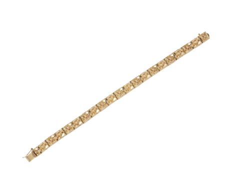 A modern textured link braceletcomposed of rectangular links, modelled as stylised gold nuggets with a textured finish, to a 