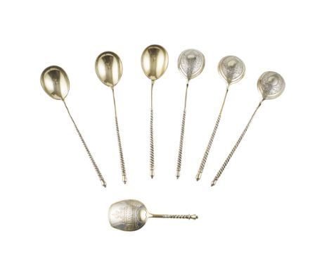A set of six Russian gilt teaspoons and matching caddy spoonStepan Levin, Moscow 1880, the shaped bowls with engraved backs, 