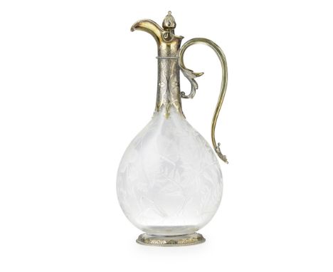 A Victorian silver gilt mounted claret jugGeorge Fox, London 1866, of flattened bottle form, with fern, foliate and fauna eng