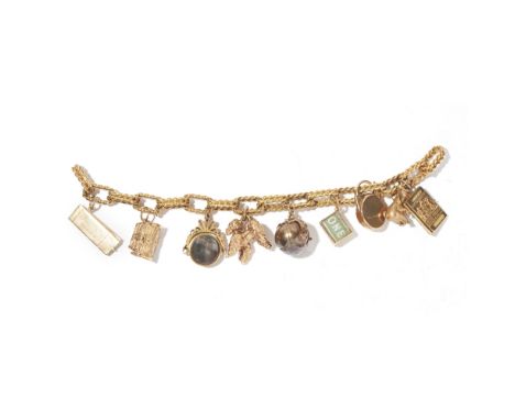 A 18ct charm braceletcomposed of rope-twist links, suspending various charms, mainly 9ct gold, including a passport, a treasu