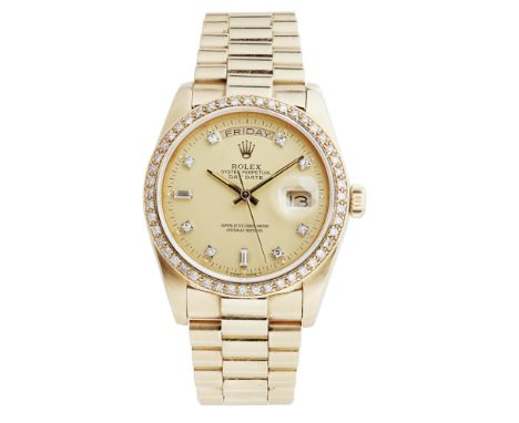 An 18ct gold and diamond set gentleman's wrist watch, RolexOyster Perpetual Day Date, ref. 18038, champagne dial, round and r