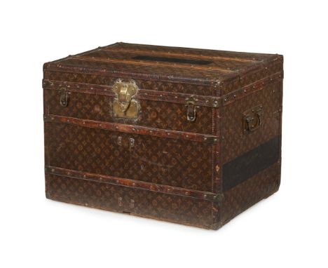 Louis Vuitton courier trunkLate 19th century, covered in signature monogram canvas with brown leather trim and wood straps wi