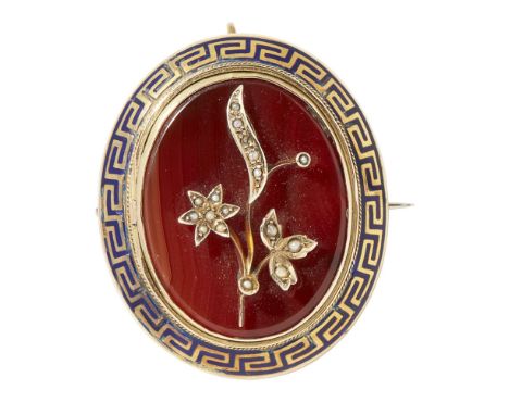 A Carnelian and seed pearl set broochcollet set with an oval carnelian plaque, applied seed pearl floral spray to centre in a