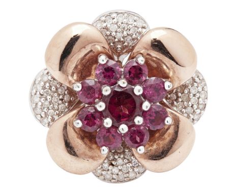 A 9ct gold garnet and diamond set cluster ringof floral design, set with a cluster of nine round-cut garnets, within a petal 