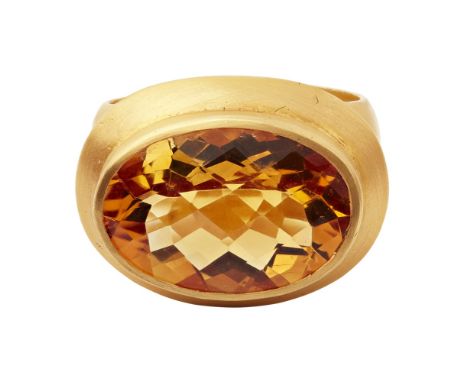 A citrine set cocktail ringcollet set with an oval mixed-cut citrine, to a plain matte finish 18ct yellow gold shankRing size