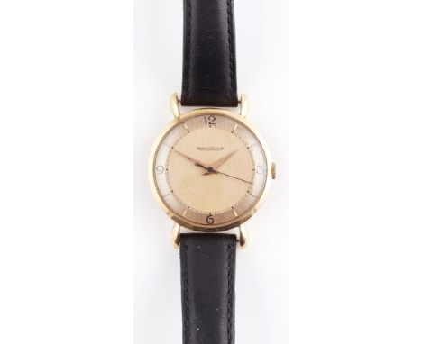 A gentleman's 9ct gold cased wrist watch, Jaeger LeCoultrethe two tone rose gold coloured dial with polished baton indicators