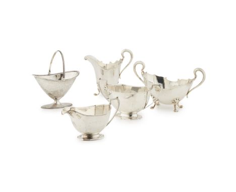 An Edwardian sugar basin and milk jugGeorge Edward &amp; Sons, Glasgow 1909, of moulded dodecagon form, C scroll handles, rai