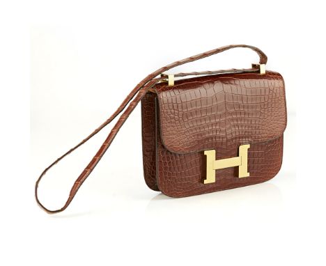 A 1977 'Constance' Bag, Hermescrocodile skin with gold tone hardware, internal zip and pouch pockets, original dust bagWidth: