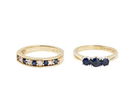 A three stone sapphire set ringclaw set with three graduated round cut sapphires, to an 18ct yellow gold shank; together with