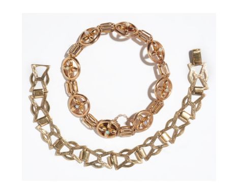An opal set braceletcomposed of alternating circular and gate links, set with small opal cabochons, to a concealed clasp stam
