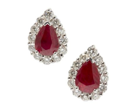 A pair of ruby and diamond set earringseach set with a pear shaped ruby in a border of round-brilliant cut diamonds, to post 