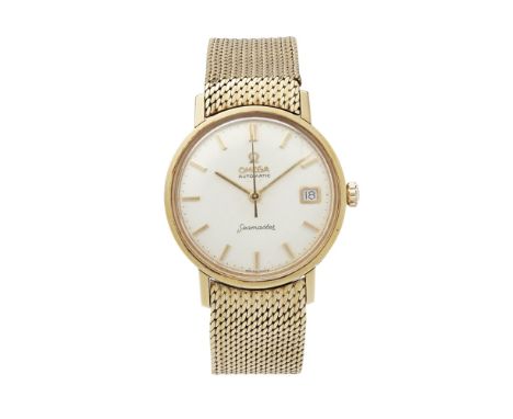 A gentleman's 18ct gold wrist watch, OmegaSeamaster, brushed silvered dial, baton indicators, sweep second hand, date apertur