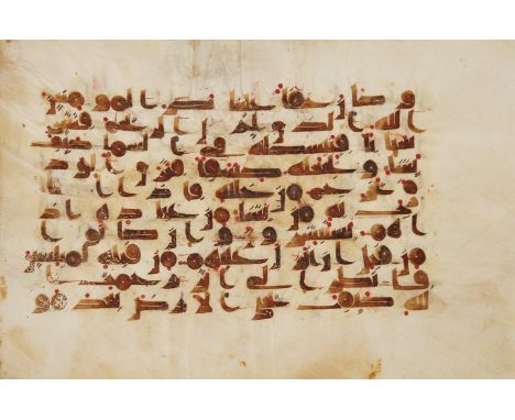 A Kufic Qur'an leaf, Near East or North Africa, 9th-10th century, Arabic manuscript on vellum, 10ll. of elegant brown Kufic s