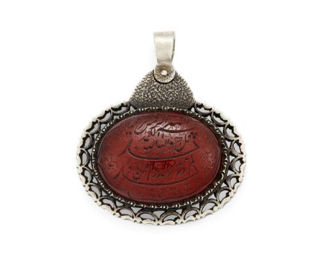 A Group of Important Works - To be sold Without ReserveA Qajar engraved carnelian, in later silver mount, Iran, 19th and 20th