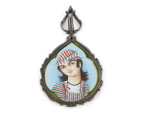 A Group of Important Works - To be sold Without ReserveA Qajar enamelled and gilt-decorated portrait of a youth, Persia, 19th