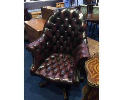 A burgundy Chesterfield button back swivel office armchair