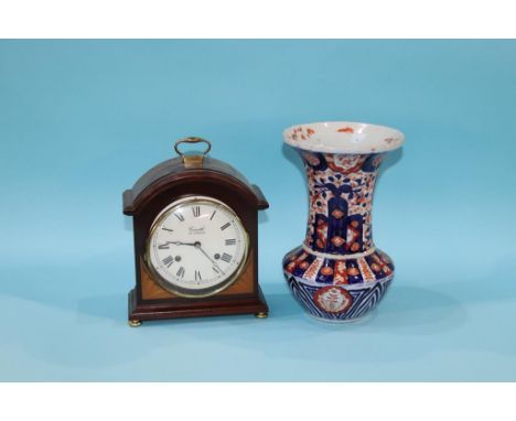 A mahogany cased Comitti of London eight day clock, with strike action, 20th height and a Japanese Imari vase with flared rim