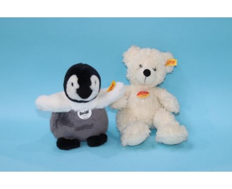 A white Steiff Bear and a Steiff Penguin