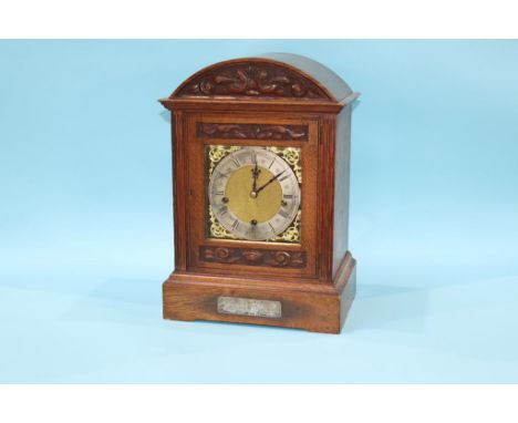 An oak bracket clock with eight day movement, with strike action, by Goldsmith Company,  41cm height