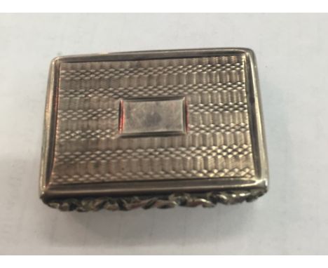 A William IV silver vinaigrette: engine-turned case with vacant cartouche, gilt interior with pierced floral scroll grill (mi